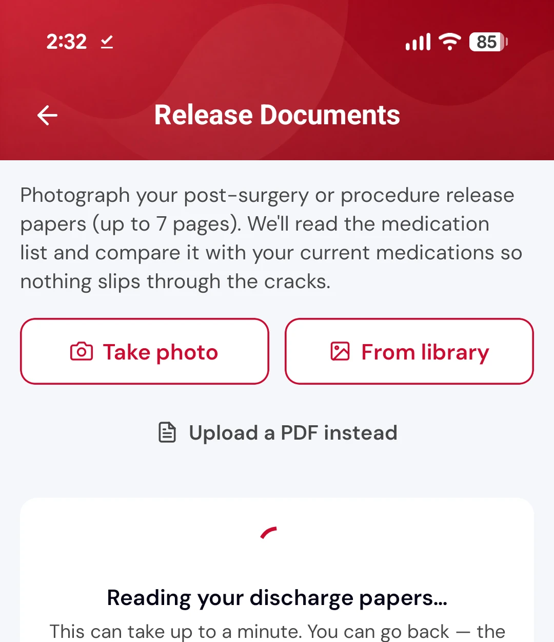 Release document upload screen offering take photo, choose from library or upload a PDF, with a message that it is reading your discharge papers